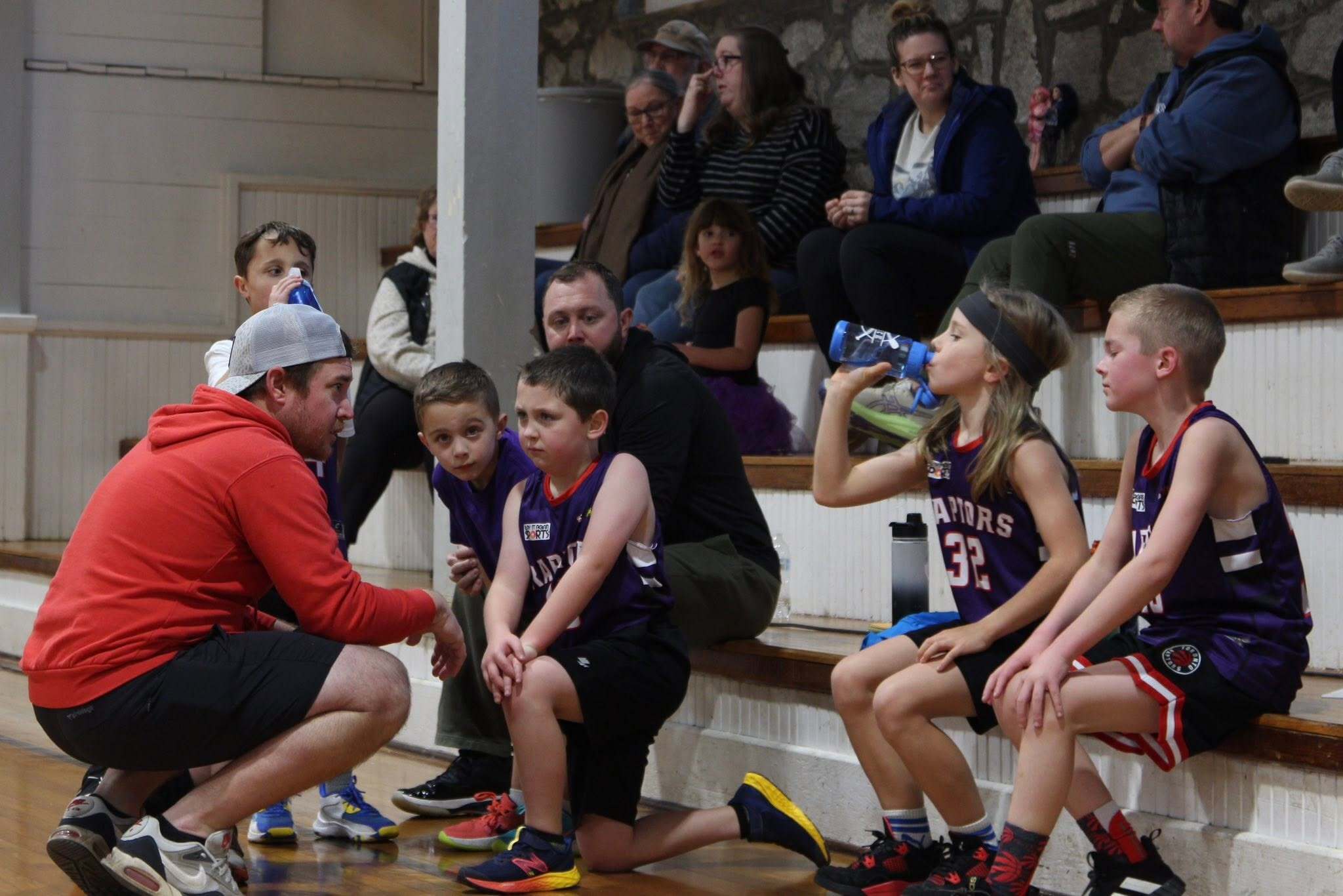 SRA coach speaking with youth athletes