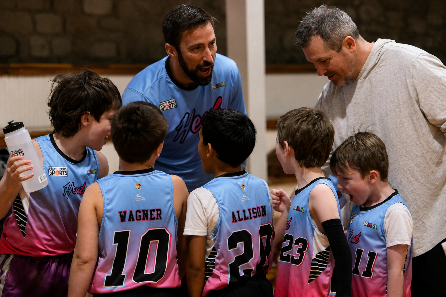 Youth basketball team gathered with coaches