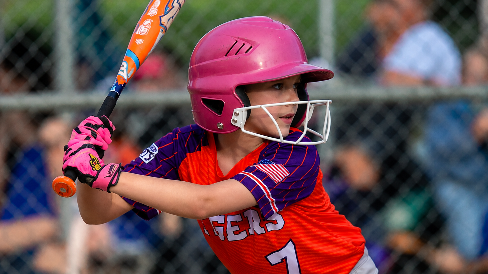 Youth softball player preparing to bat