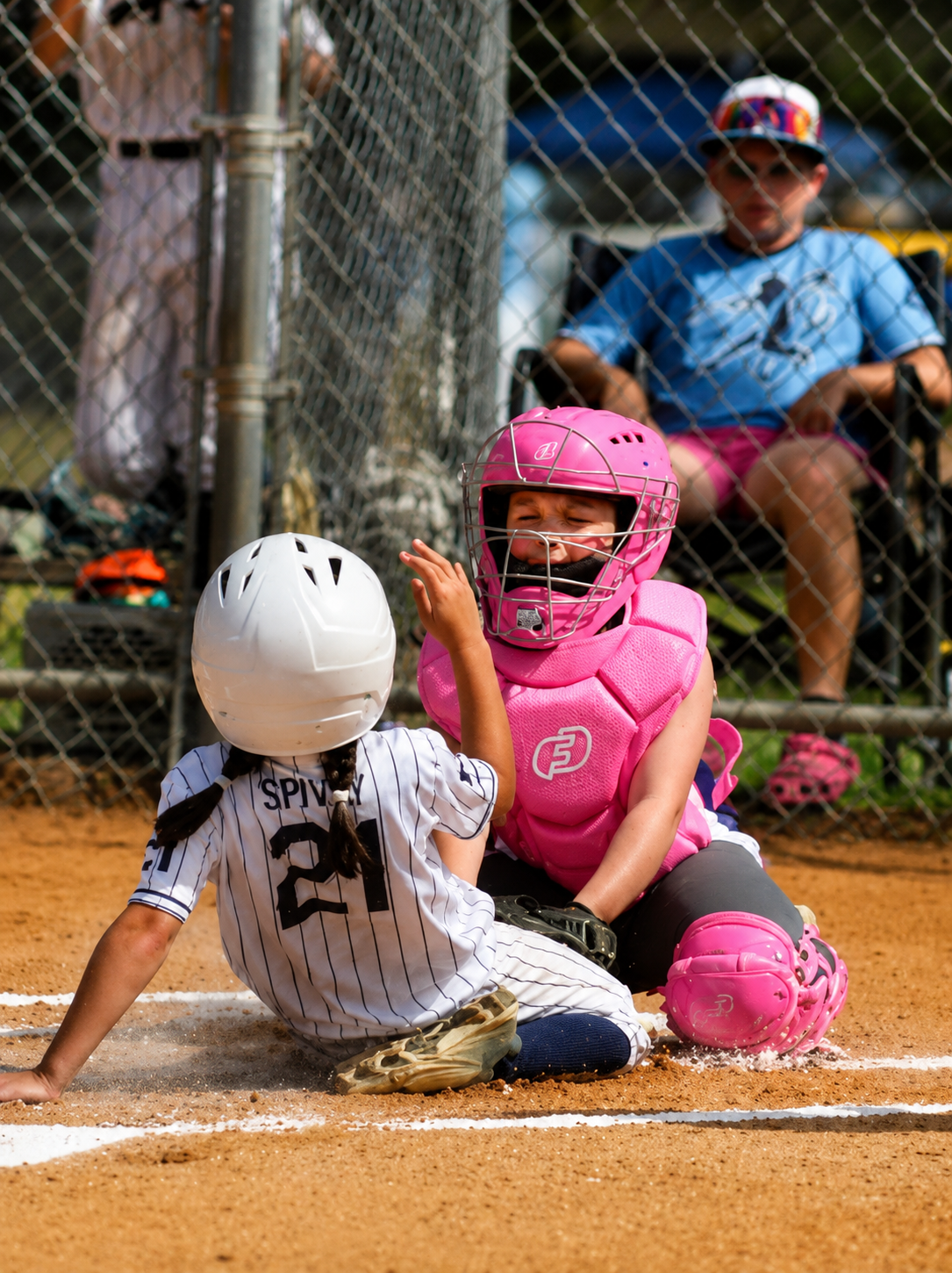SRA softball action at home plate